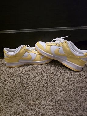 Nike Dunk Low GS sneakers in the White/Soft Yellow colorway, code FB9109-126.